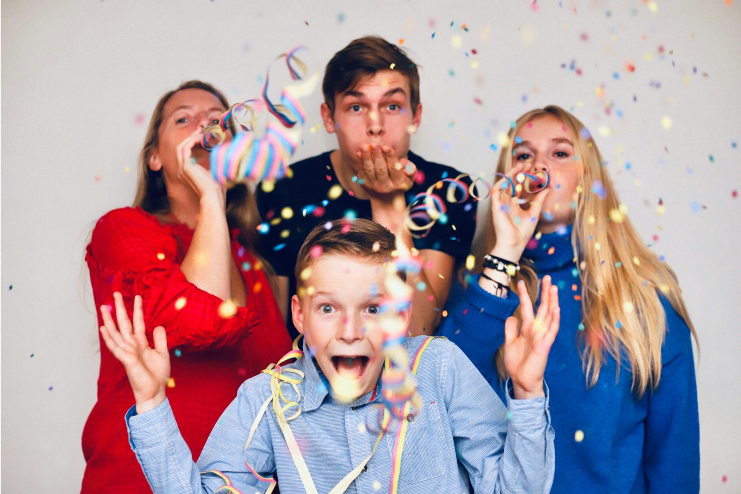 A happy family celebrating after overcoming a financial hurdle.