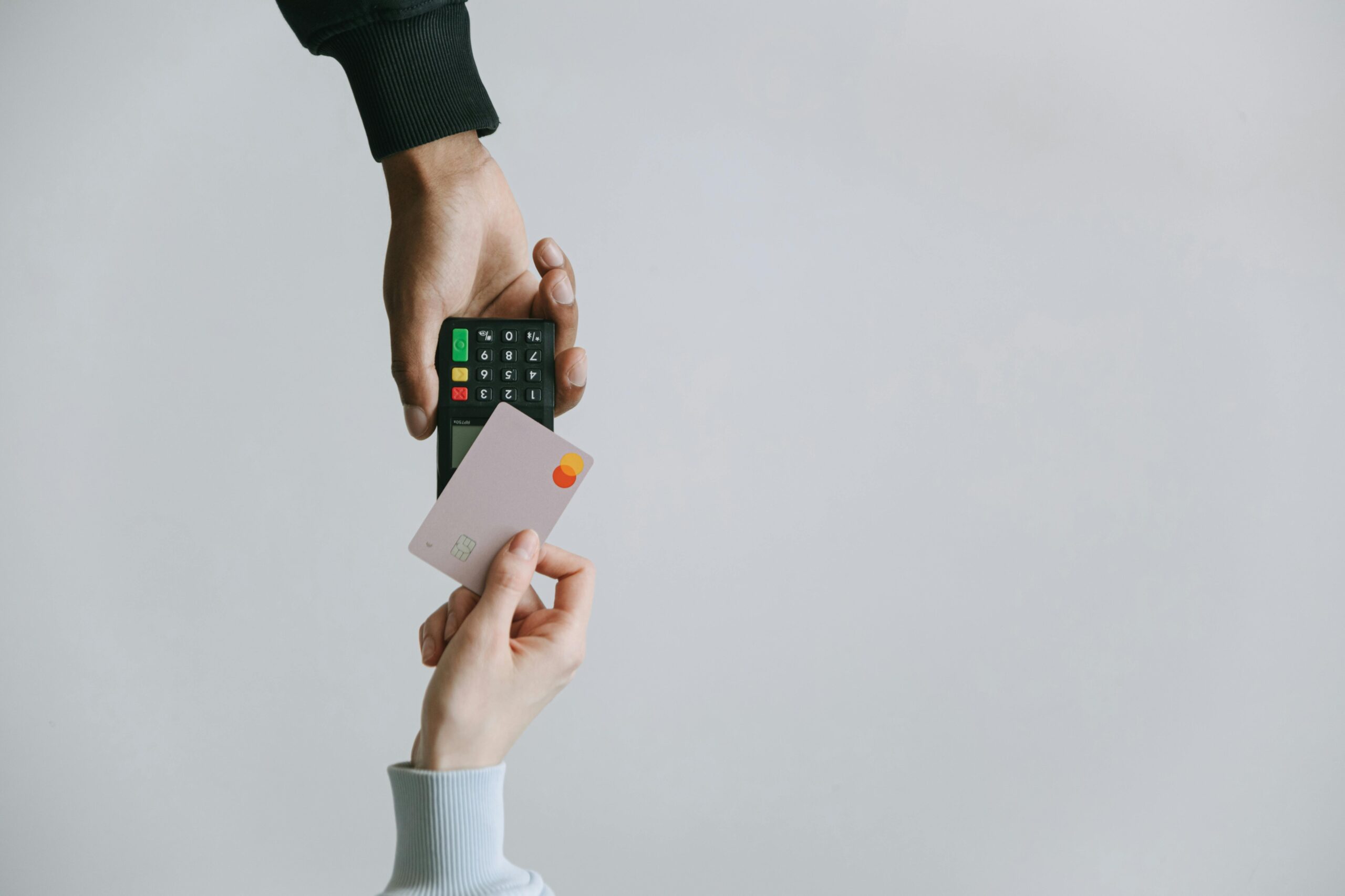 Comparison chart outlining pros and cons of using separate versus joint credit cards