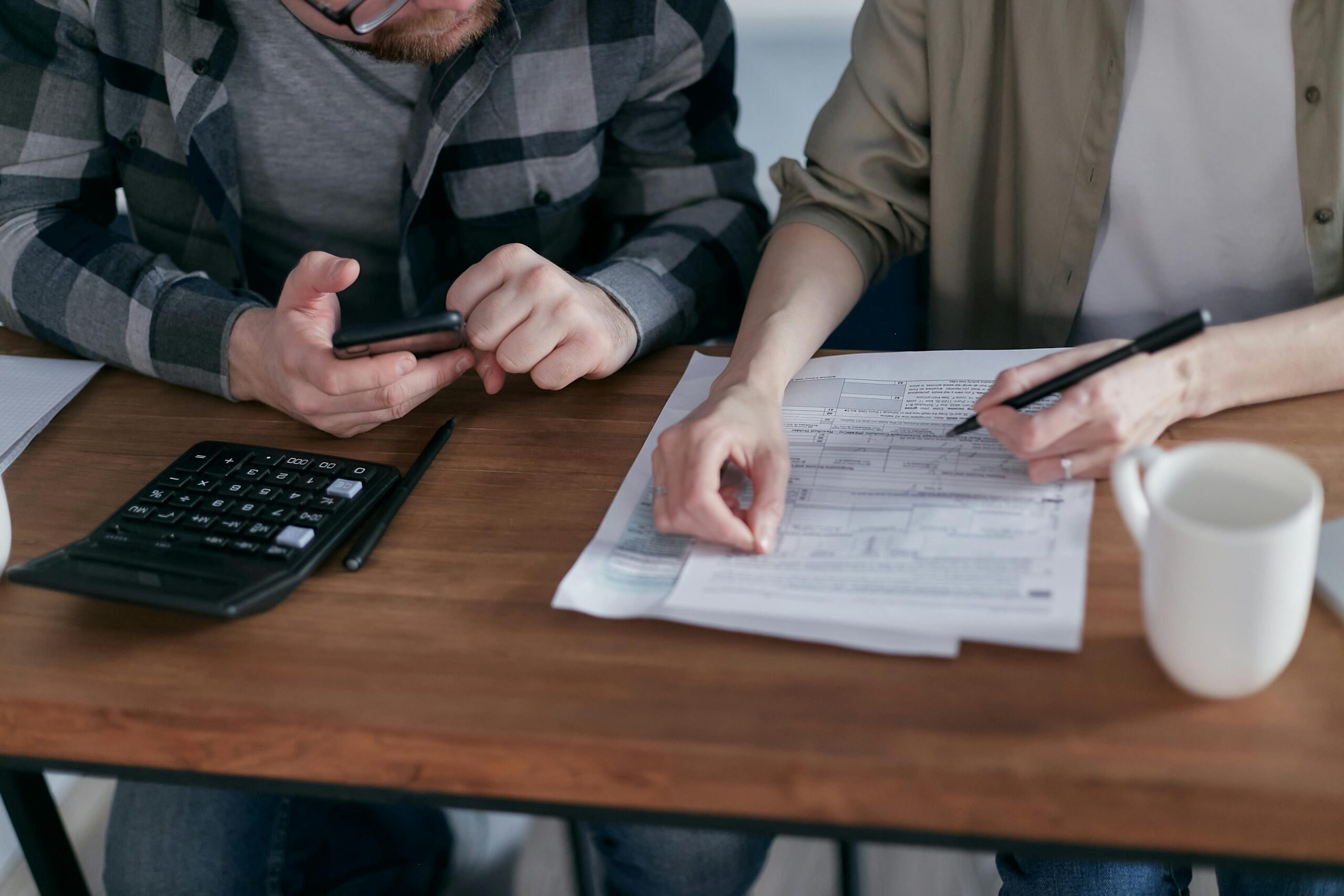 Couple reviewing their credit scores together before applying for a joint credit card