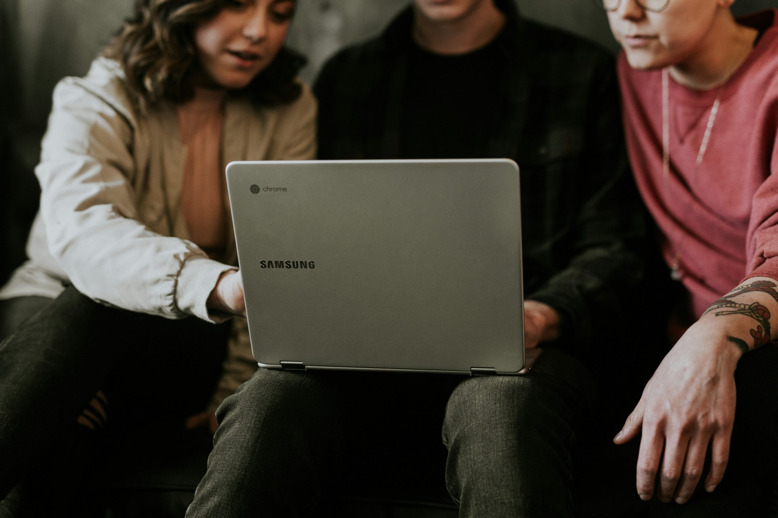 Happy couple reviewing laptop screen together, smiling