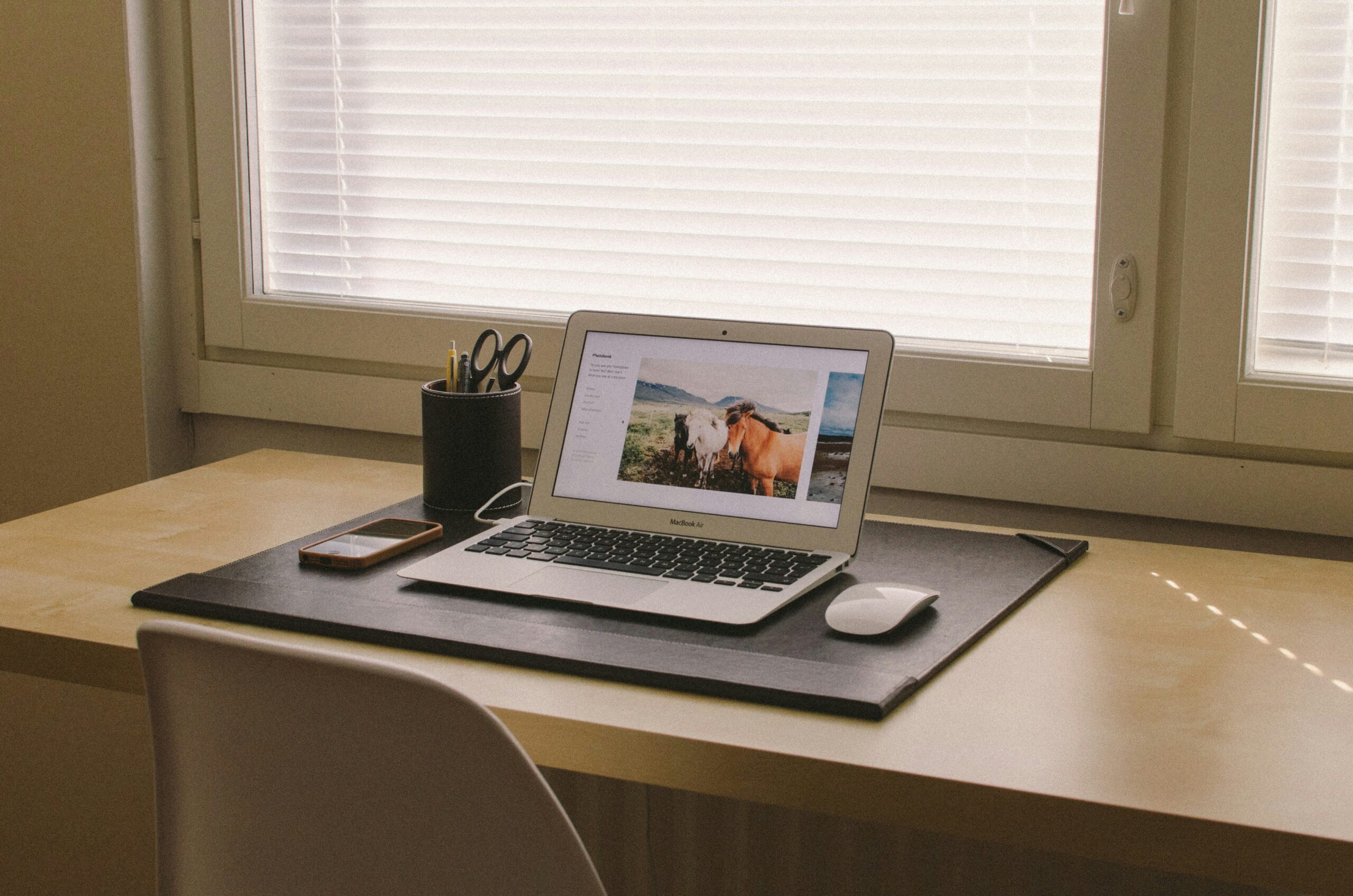 Illustration showing two people reviewing a joint credit card agreement on a laptop.