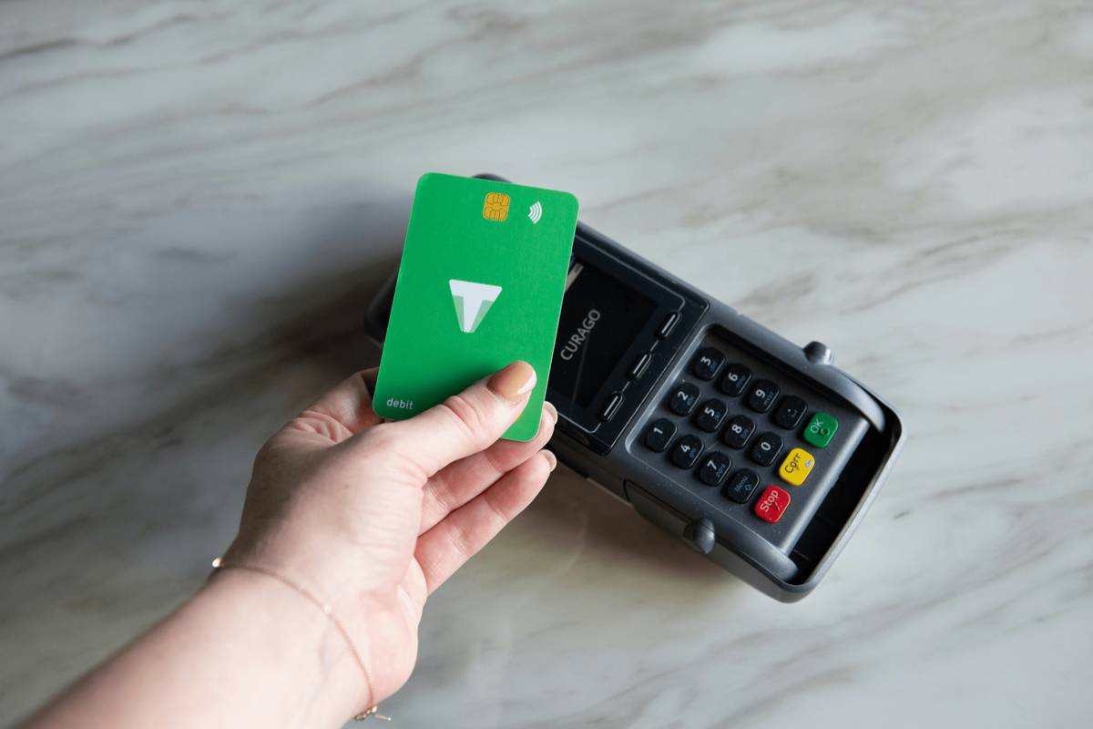 Couple sitting at kitchen table filling out joint credit card application