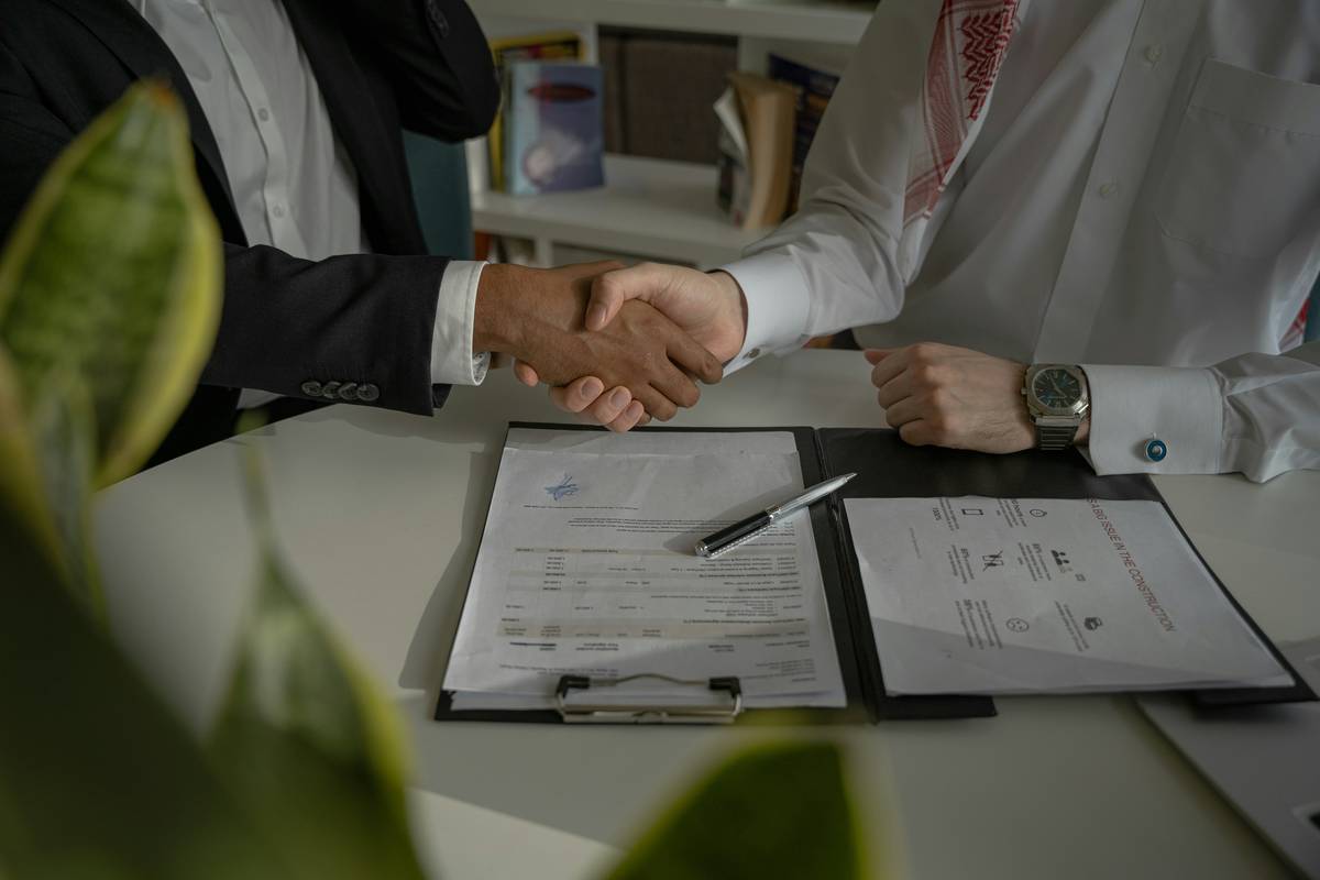 Two people filling out paperwork to apply for a joint credit card