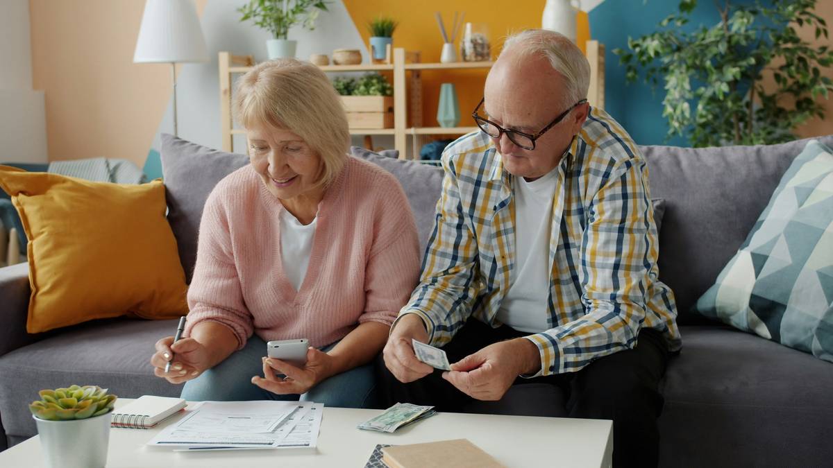 Illustration showing couple reviewing documents while seated together.